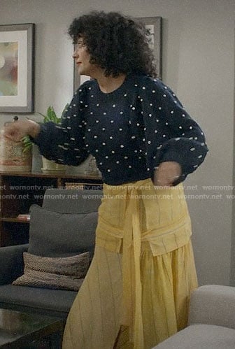 Bow’s pom pom sweater and yellow striped skirt on Black-ish