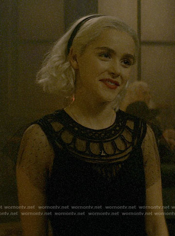 Sabrina’s black mesh sleeve dress on Chilling Adventures of Sabrina