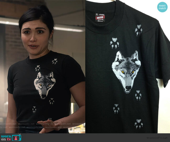 Top: Vintage 1980s Deadstock Wolf and Paw Print T-Shirt worn by Cassidy Barrett (Daniella Pineda) on What/If