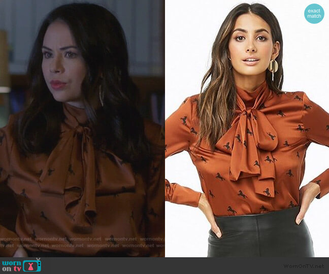 Forever 21 Horse Print Mock Neck Satin Top worn by Mona Vanderwaal (Janel Parrish) on Pretty Little Liars The Perfectionists