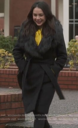 Mona’s black fur trim coat on Pretty Little Liars The Perfectionists