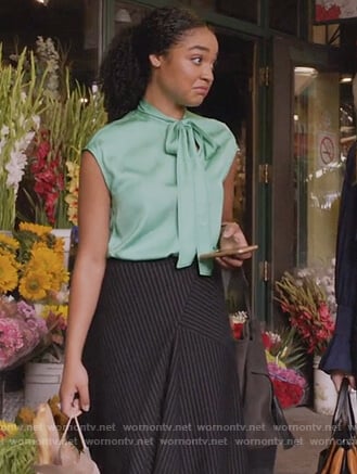 Kat’s green tie neck top and pinstripe skirt on The Bold Type