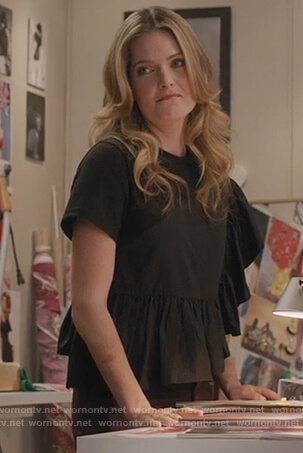 Sutton’s black ruffle top on The Bold Type
