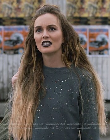 Angie’s black splatter sweater on Single Parents