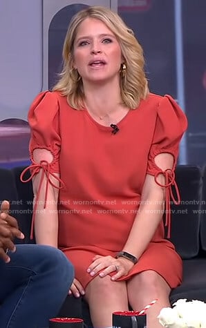 Sara’s orange ruched sleeve dress with ties on GMA Strahan And Sara