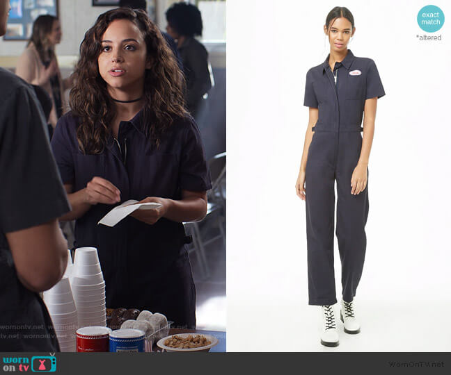 Urban Outfitters Patch Graphic Zip-Front Utility Jumpsuit worn by Moe Truax (Kiana Madeira) on Trinkets