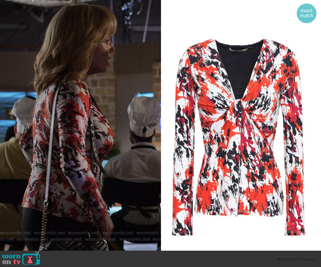 Roberto Cavalli Twist-front printed stretch-jersey top worn by Dorothy Walker (Rebecca De Mornay) on Jessica Jones