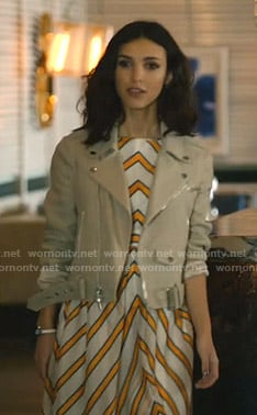 Alicia’s white and orange striped dress and beige jacket on Grand Hotel