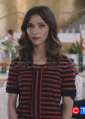 Alicia’s red striped tie neck top on Grand Hotel