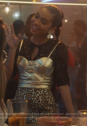 Zoey’s metallic blouse and leopard skirt on Grown-ish