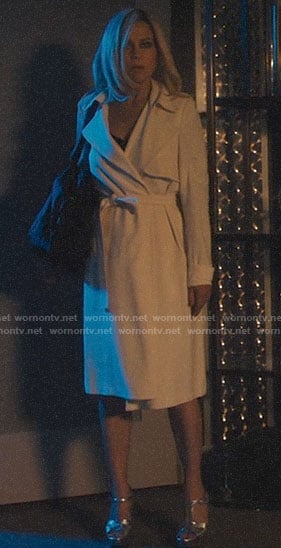Jett’s white trench coat and silver sandals on Jett
