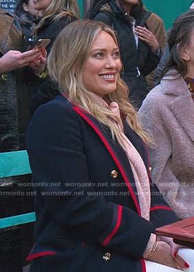 Kelsey’s navy coat with red piping on Younger