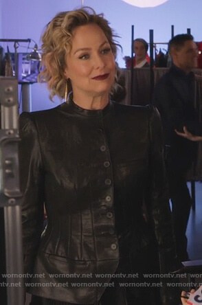 Jacqueline’s black leather jacket and pleated skirt on The Bold Type