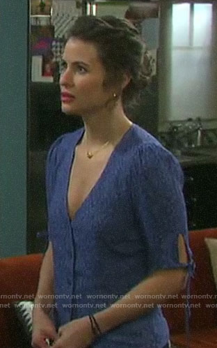 Sarah’s blue floral v-neck top with tie sleeves on Days of our Lives
