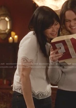 Cassie’s white lace-trim tee on Good Witch