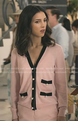 Alicia’s pink pearl-button cardigan on Grand Hotel