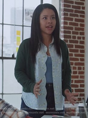 Mariana’s blue floral blouse with scalloped trim on Good Trouble