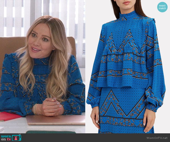 Ganni Cloverdale Pleat Detail Printed Blouse worn by Kelsey Peters (Hilary Duff) on Younger