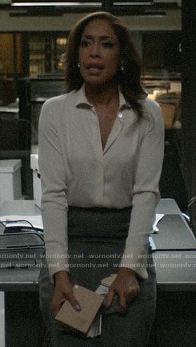 Jessica’s white button down blouse and checked skirt on Pearson