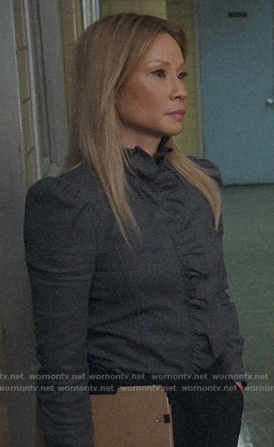 Joan’s grey ruffled trim shirt on Elementary