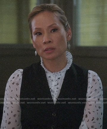 Joan’s white floral ruffle trim blouse on Elementary