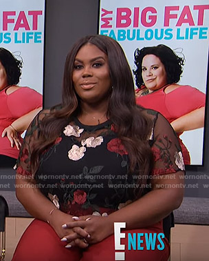 Nina’s black floral cropped sheer top on E! News