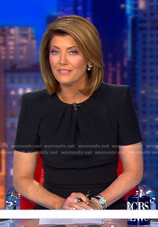 Norah’s black pleated neck sheath dress on CBS Evening News