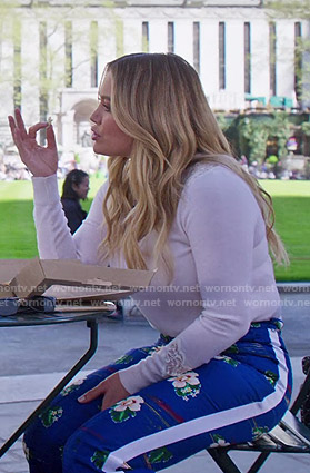 Kelsey’s white lace inset sweater and blue floral pants on Younger