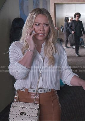 Kelsey’s white striped shirt and leather pants on Younger