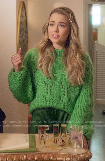 Ainsley’s green pointelle knit sweater and pleated skirt on Four Weddings and a Funeral