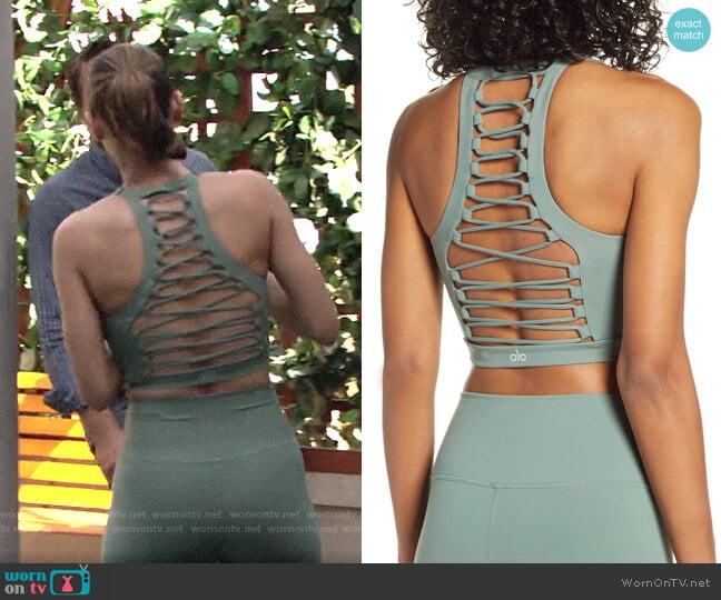 Alo Yoga Movement Lace-Up Sports Bra in Moss worn by Elena Dawson (Brytni Sarpy) on The Young and the Restless