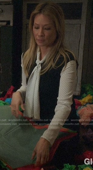Joan’s white polka dot tie neck blouse on Elementary