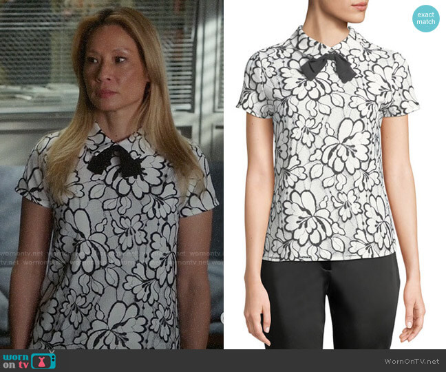 Karl Lagerfeld Paris Floral Lace Short-Sleeve Bow Tie Top worn by Joan Watson (Lucy Liu) on Elementary