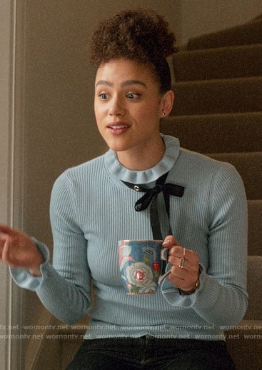 Maya’s blue sweater with studded neck bow on Four Weddings and a Funeral