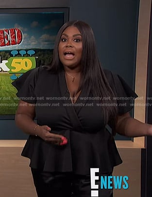 Nina’s black peplum top on E! News