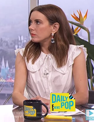 Melanie’s white ruffle top and polka dot sandals on E! News Daily Pop