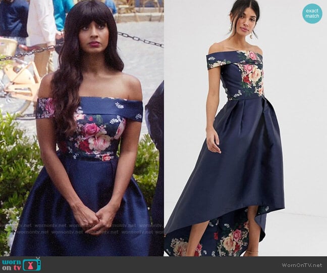 Chi Chi London Tall bardot neck prom dress with high low hem in navy floral worn by Tahani Al-Jamil (Jameela Jamil) on The Good Place