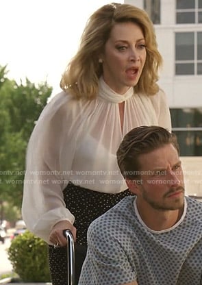 Laura Van Kirk’s white keyhole blouse and dotted skirt on Dynasty
