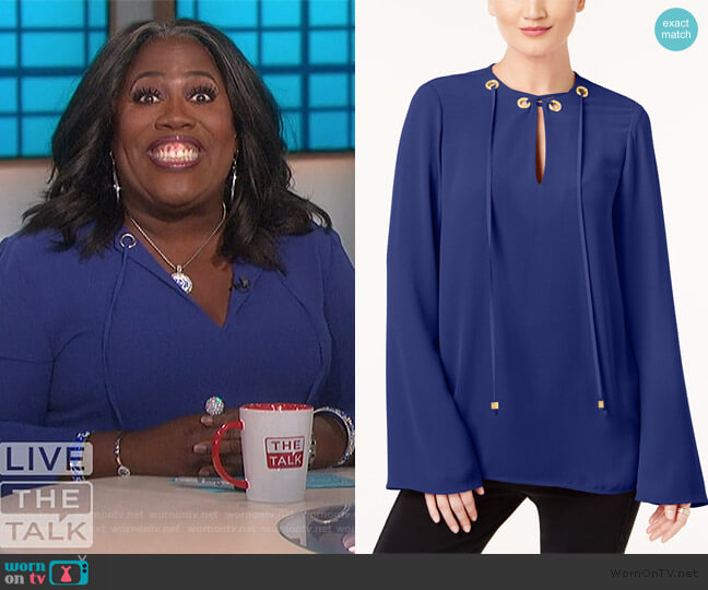 MICHAEL Michael Kors Embellished Grommet Tie-Neck Top worn by Sheryl Underwood on The Talk