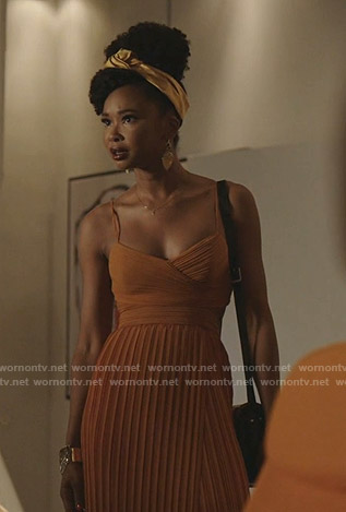 Monica’s orange pleated dress on Dynasty