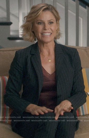 Claire’s pinstriped suit and red top on Modern Family
