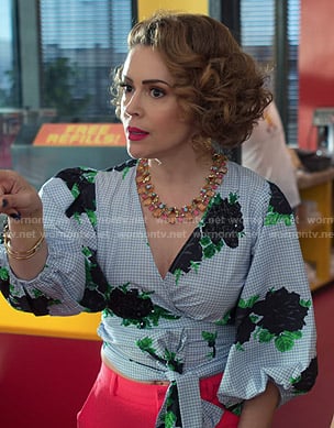 Coralee’s blue gingham check floral wrap top on Insatiable