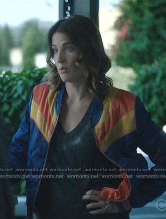 Dex’s blue and yellow bomber jacket on Stumptown