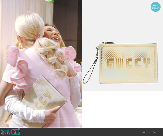 Gucci Star Print Guccy Clutch Bag worn by LeeAnne Locken on The Real Housewives of Dallas