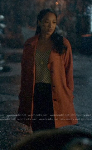 Iris’s geometric print top and orange trench coat on The Flash