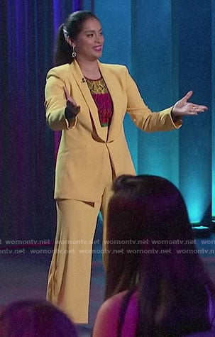 Lilly’s yellow suit and rainbow snake print top on A Little Late with Lilly Singh