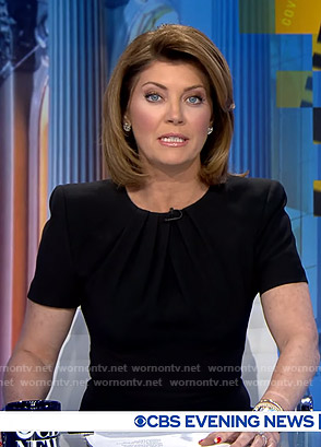 Norah’s black pleated neck sheath dress on CBS Evening News