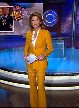 Norah’s yellow belted suit on CBS Evening News