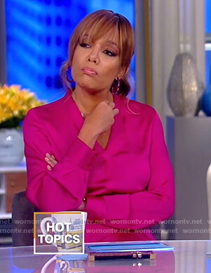 Sunny’s pink asymmetric satin dress on The View
