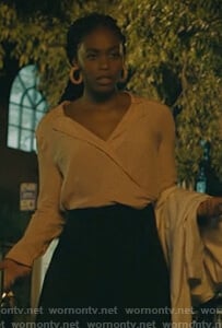 Anissa’s light pink wrap top on Black Lightning